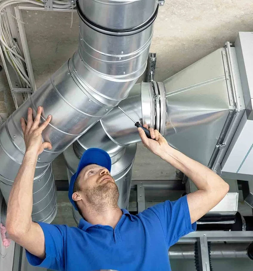 Local air conditioning contractor performing seasonal AC maintenance for a Los Angeles homeowner